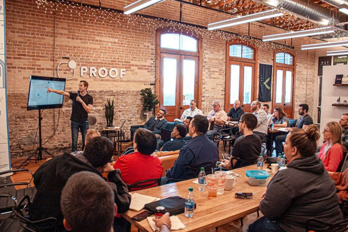 Workshop presenter leading a small group